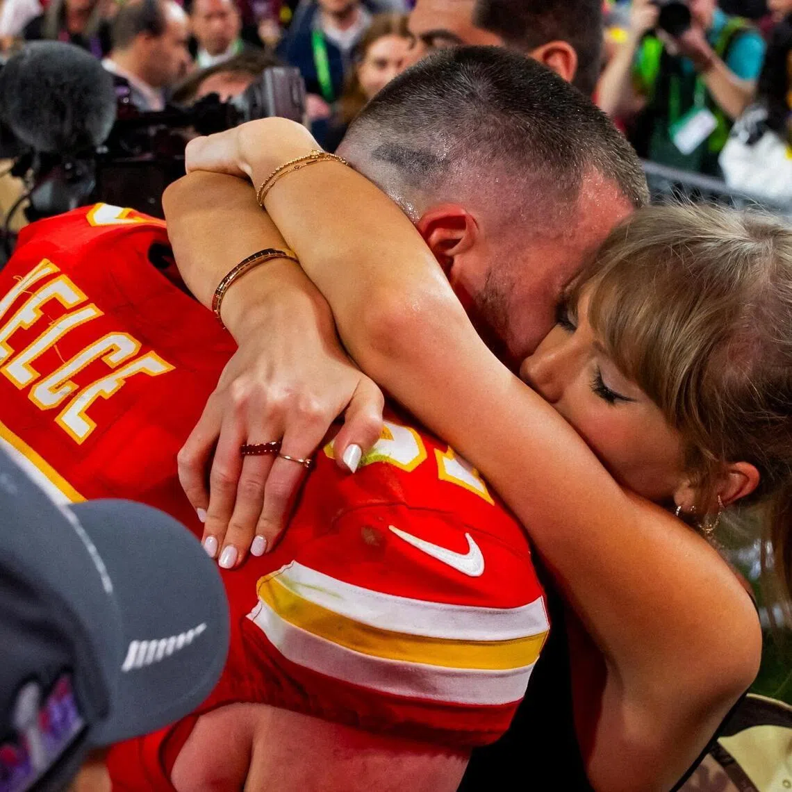Travis Kelce celebrates with pop megastar Taylor Swift after defeating the San Francisco 49ers in Super Bowl LVIII in 2024.