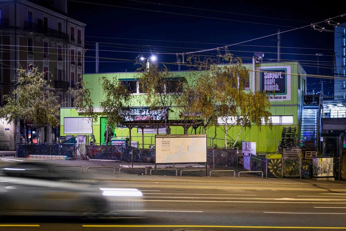 Behind Geneva's main railway station, a lime-green container structure called Quai 9 offers a space where people can shoot up, inhale or sniff drugs under medical supervision. 