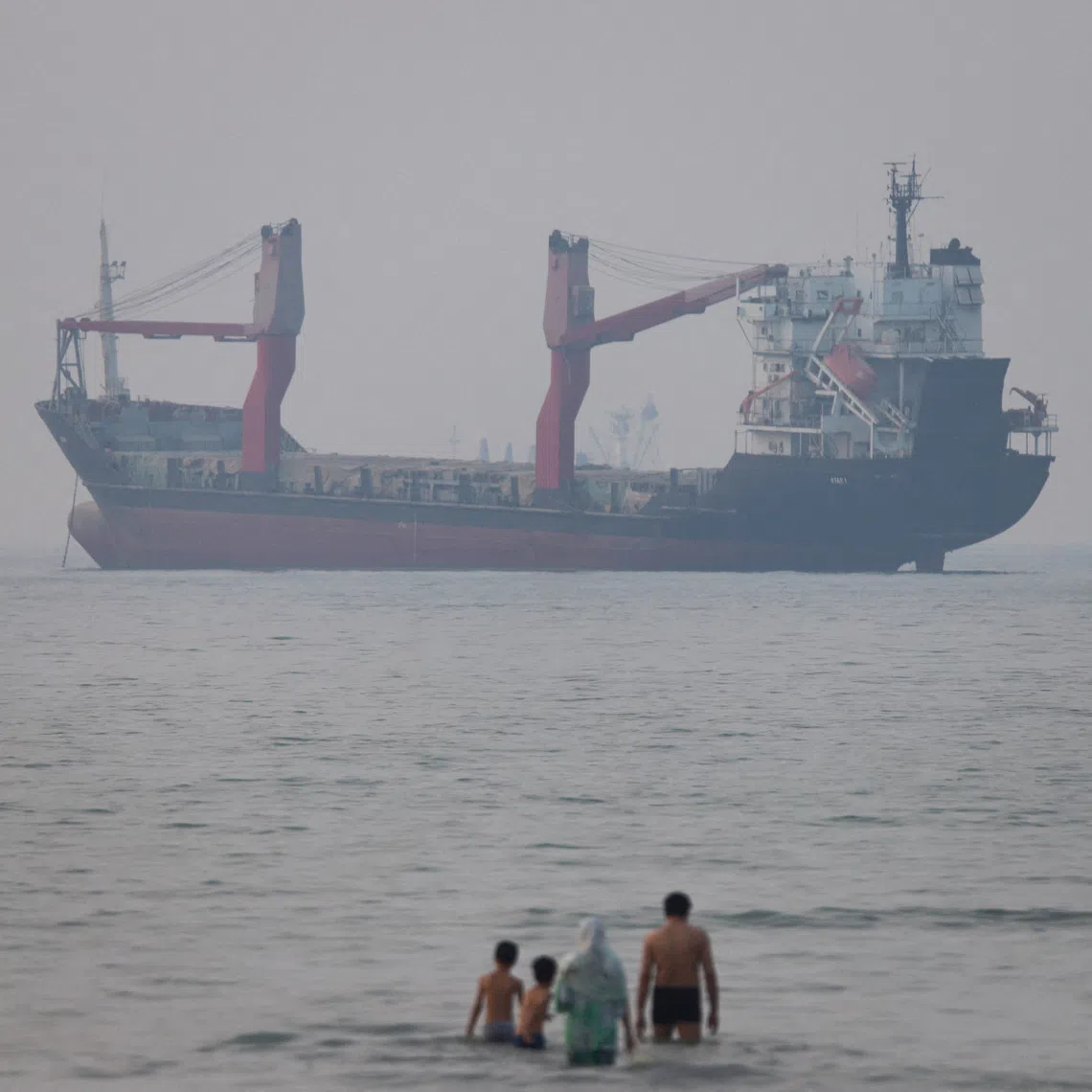 FILE PHOTO: A vessel in the Strait of Hormuz near the beach of Bandar Abbas, Iran, June 30, 2026. Amirhosein Khorgooi/ISNA/via WANA (West Asia News Agency)via REUTERS