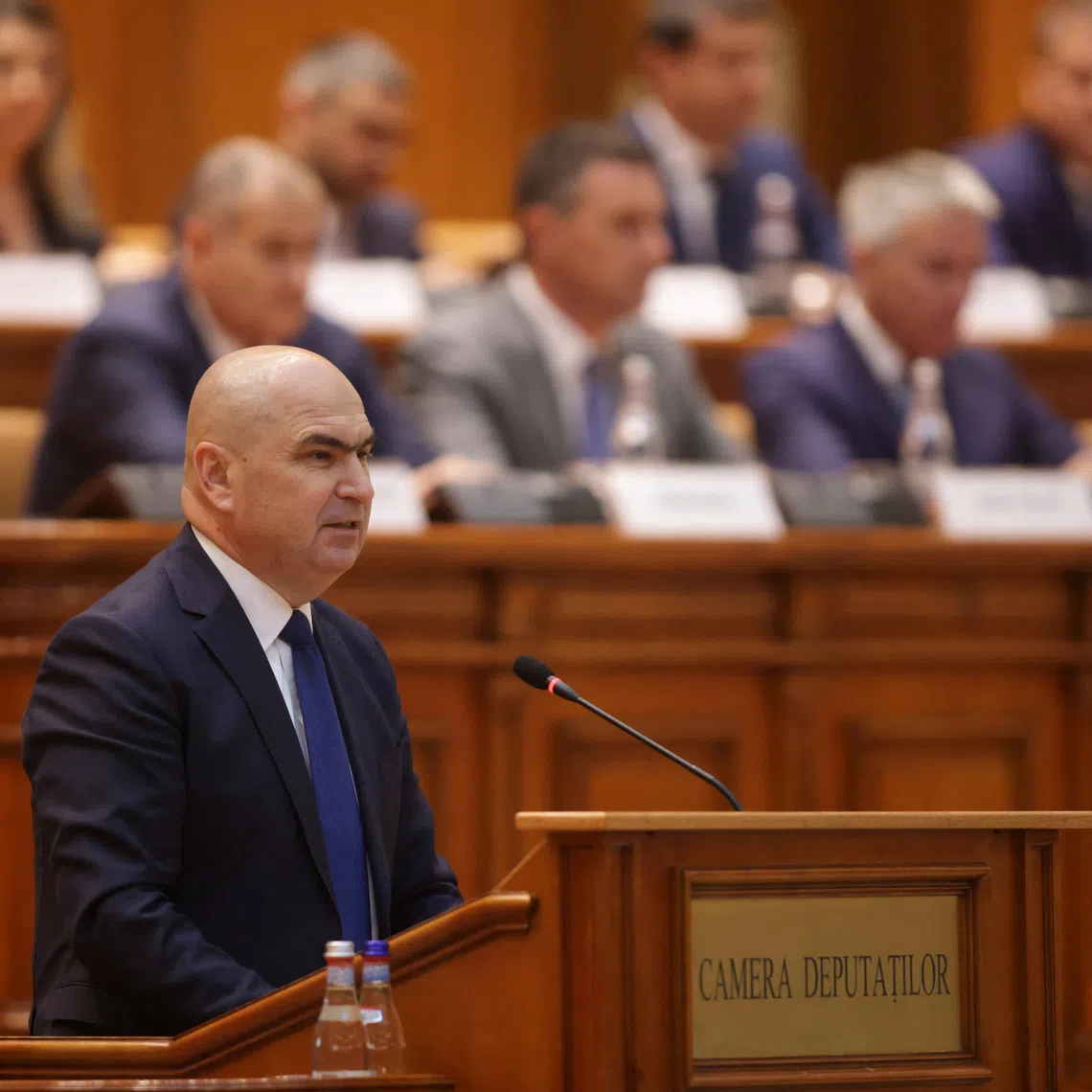 Romania's designated Prime Minister Ilie Bolojan delivers a speech at the start of a joint parliamentary session, ahead of a vote of confidence in his coalition, in Bucharest, Romania, June 23, 2025. Inquam Photos/George Calin via REUTERS