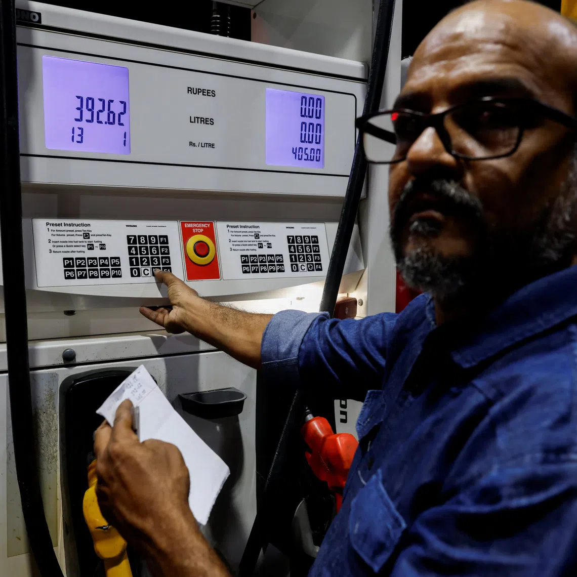 A worker updates the fuel price at a petrol station following the rollout of a fuel relief scheme, which provides a fuel subsidy for eligible motorcycles, rickshaws and vehicles with engines of up to 800cc, in Karachi, Pakistan, September 16, 2026. REUTERS/Akhtar Soomro