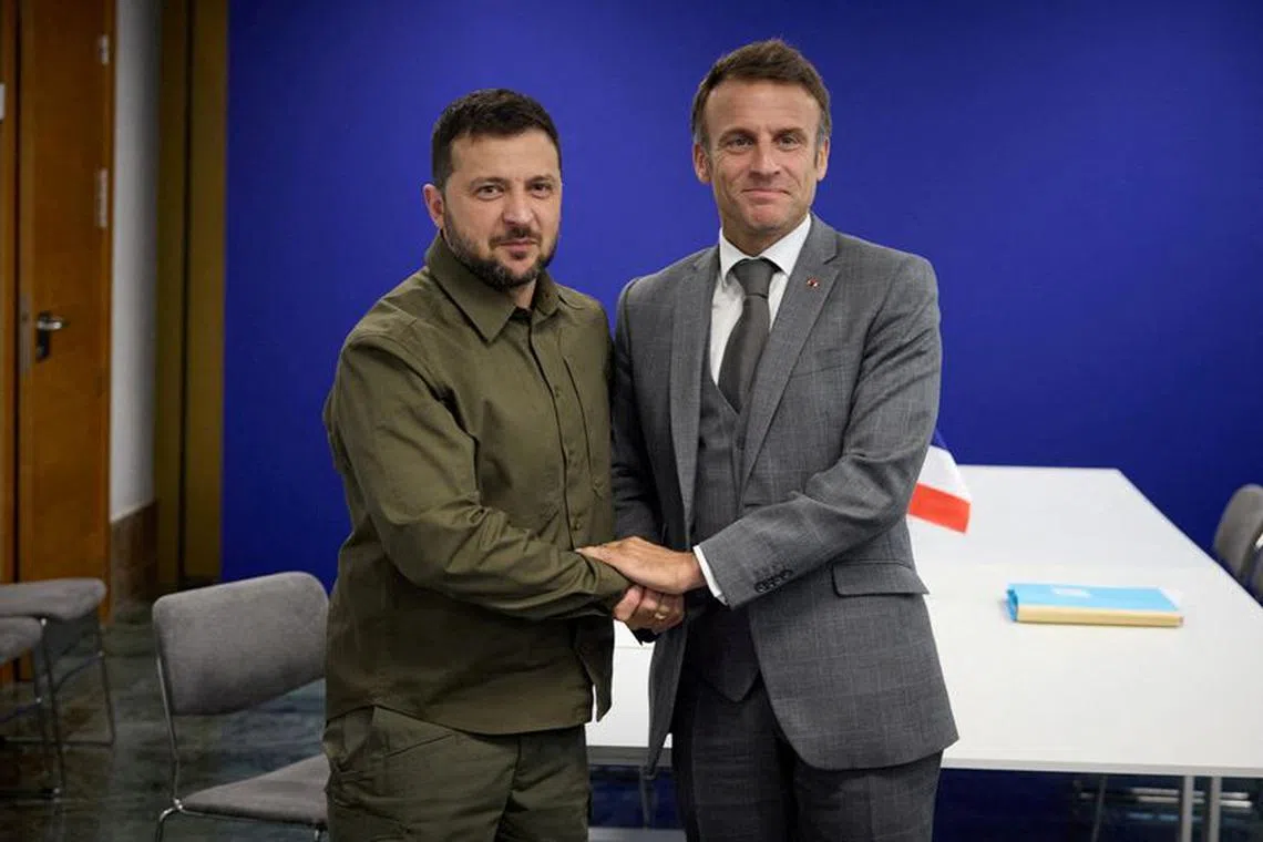 Ukraine's President Volodymyr Zelenskiy and French President Emmanuel Macron pose for a picture during a meeting on the sidelines of the European Political Community Summit in Granada, Spain October 5, 2023. Ukrainian Presidential Press Service/Handout via REUTERS /File Photo