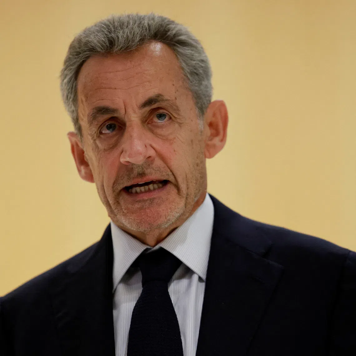 Former French President Nicolas Sarkozy talks to journalists after the verdict in his trial with other defendants on charges of corruption and illegal financing of an election campaign related to alleged Libyan funding of his successful 2007 presidential bid, at the courthouse in Paris, France, September 25, 2025. REUTERS/Stephanie Lecocq