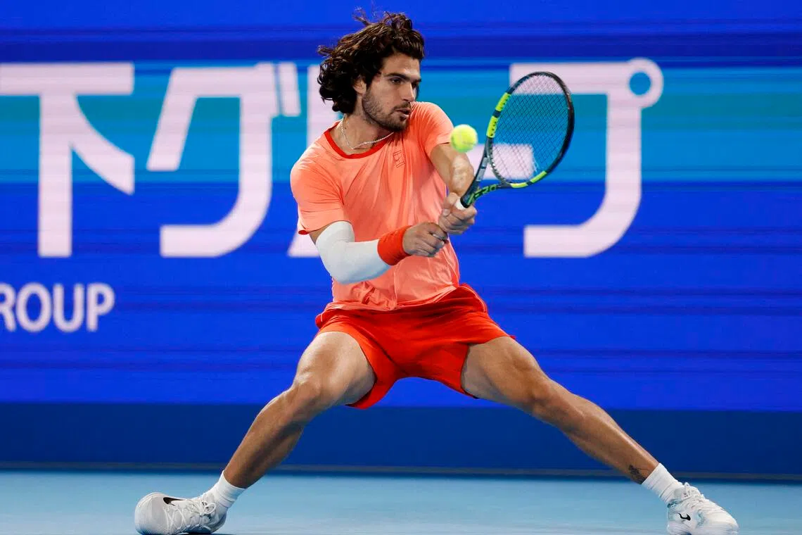 Spain’s Carlos Alcaraz returning to his compatriot Jaume Munar in their Japan Open semi-final at Ariake Coliseum in Tokyo on Oct 5.
