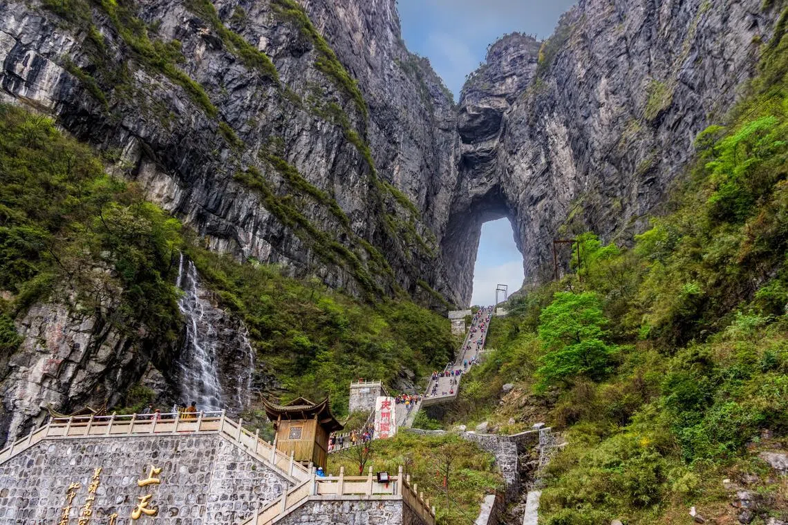 Tianmen Cave is a massive, high-altitude natural karst arch  located in Tianmen Mountain National Forest Park in Zhangjiajie, in the northwestern part of Hunan province, China. 
