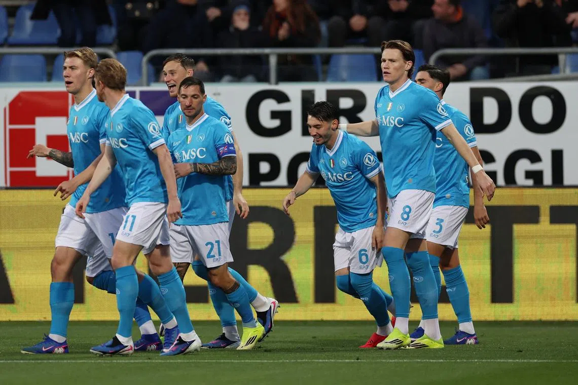 Soccer Football - Serie A - Cagliari v Napoli - Unipol Domus, Cagliari, Italy - March 20, 2026 Napoli's Scott McTominay celebrates scoring their first goal with teammates REUTERS/Ciro De Luca