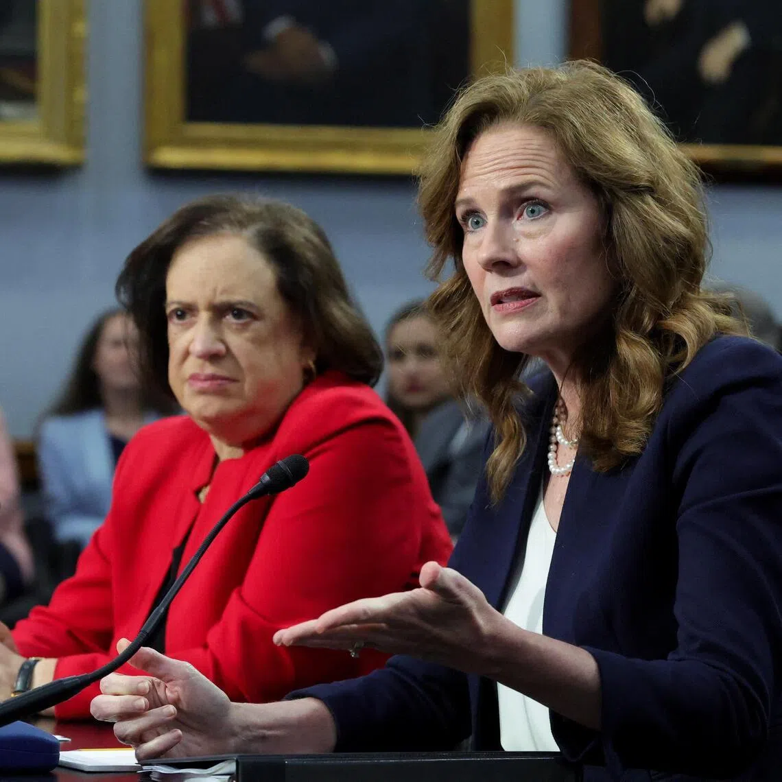 US Supreme Court justices Elena Kagan (left) and Amy Coney Barrett testifying before Congress on July 14.