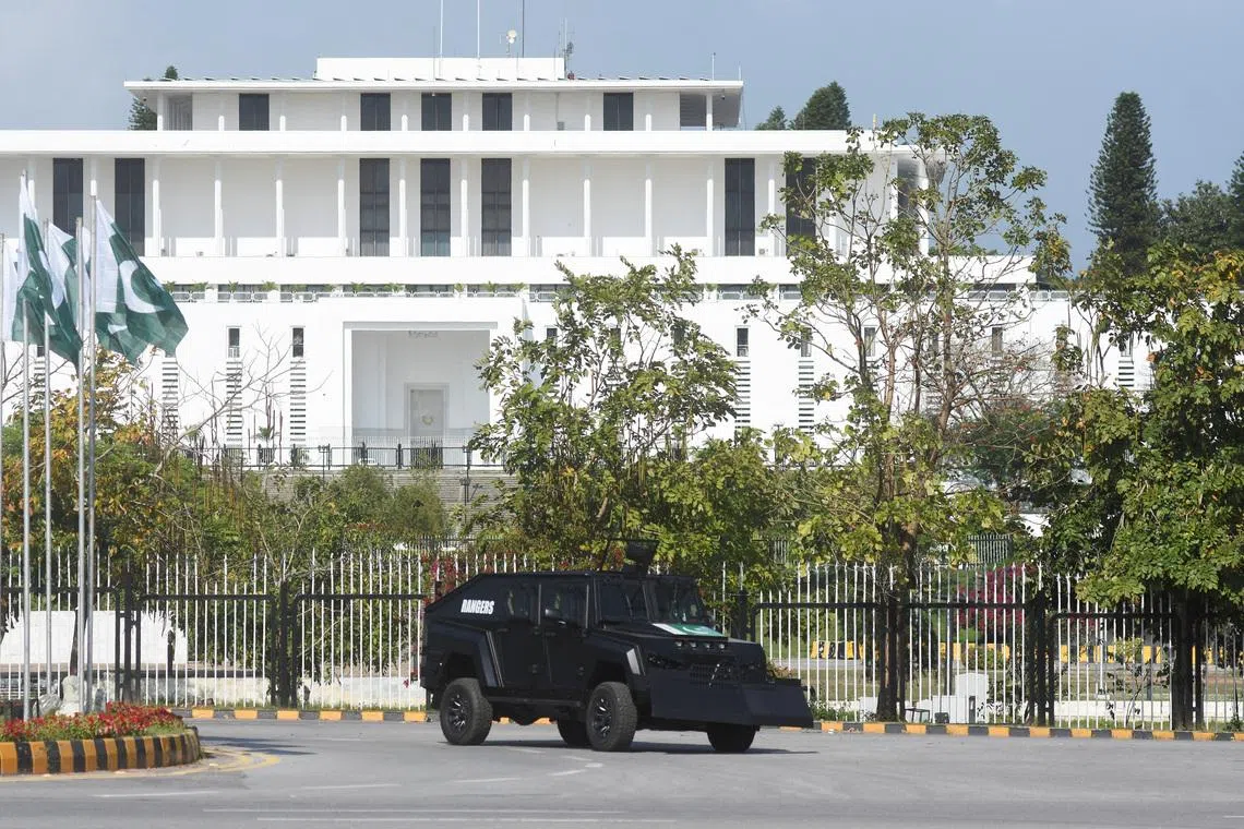 A security vehicle moves past the President house as Pakistan gears up to host the US and Iran for peace talks, in Islamabad, Pakistan, on April 9.