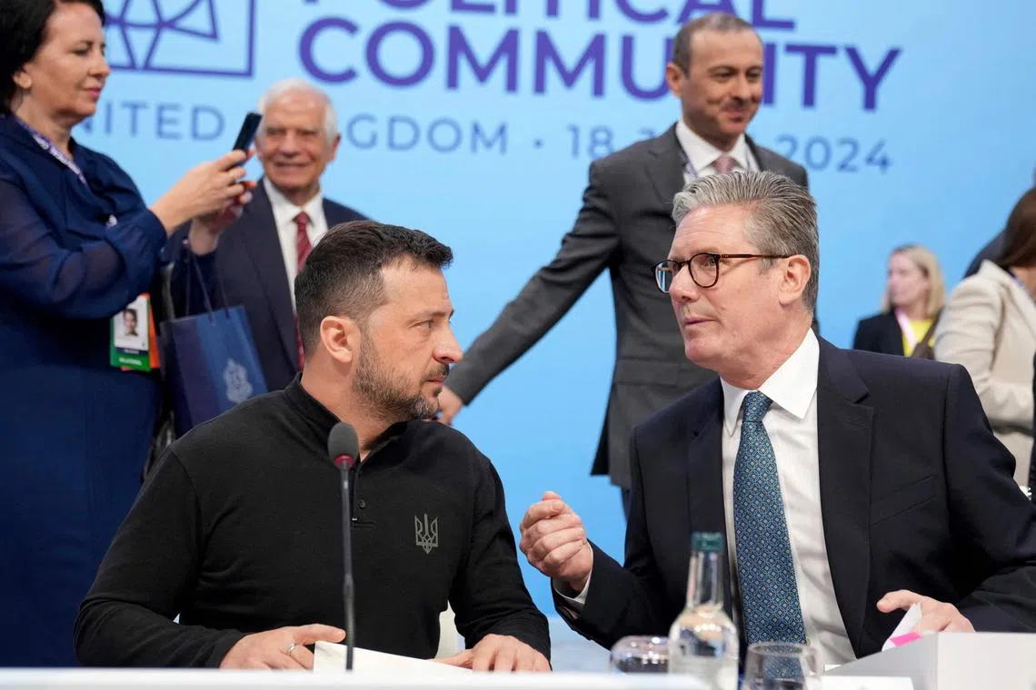 Britain's Prime Minister Keir Starmer (right) speaking to Ukrainian President Volodymyr Zelensky at the European Political Community meeting, at Blenheim Palace in England, on July 18.