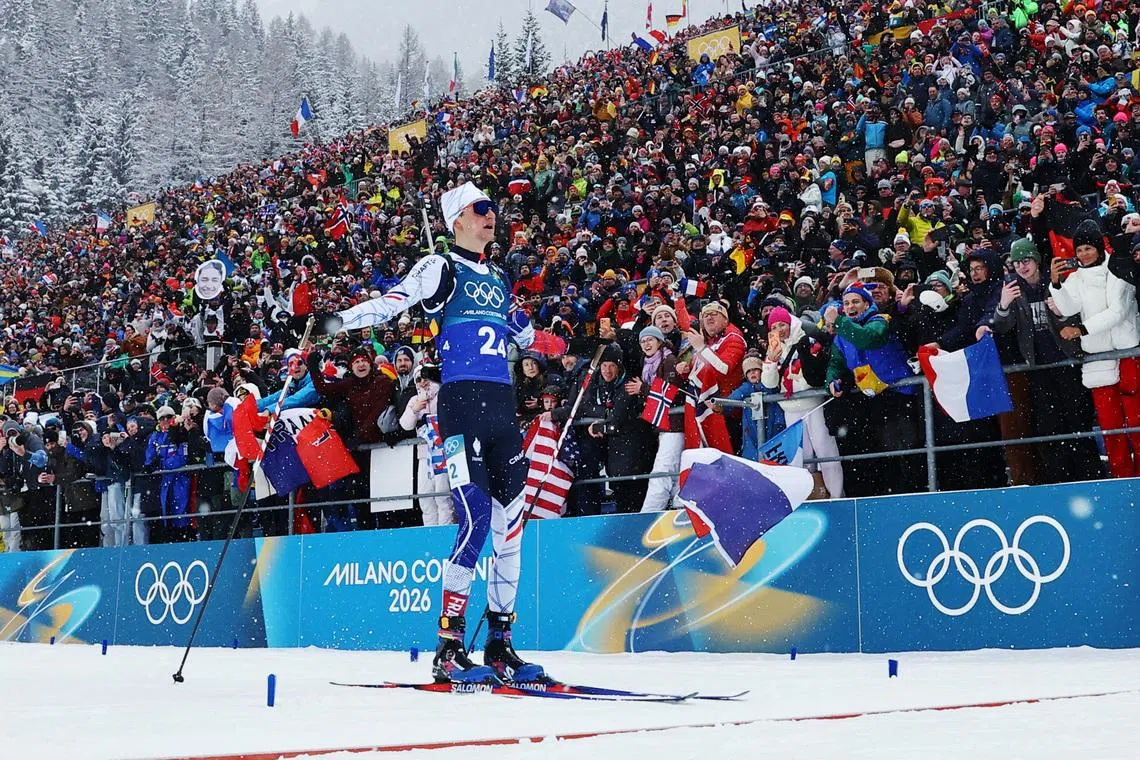 Milano Cortina 2026 Olympics - Biathlon - Men's 4 x 7.5km Relay - Anterselva Biathlon Arena, South Tyrol, Italy - February 17, 2026. Gold medallist Eric Perrot of France crosses the line to win the Men's 4 x 7.5km Relay REUTERS/Matthew Childs