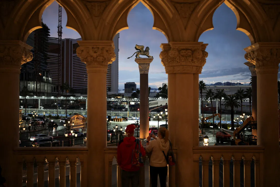 A couple clicks pictures of the Las Vegas Strip Circuit, as preparations for the Formula One F1 - Las Vegas Grand Prix continue in Las Vegas, Nevada, U.S., November 18, 2025. REUTERS/Daniel Cole