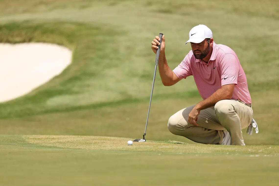 Scottie Scheffler of the United States lining up a putt on the ninth green during the second round of the FedEx St Jude Championship on Aug 14.