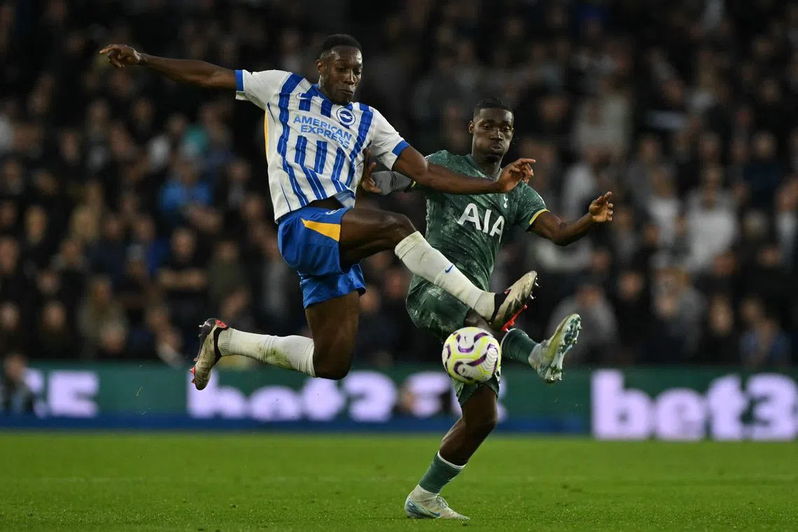 Brighton's English striker Danny Welbeck (left) vies with Tottenham Hotspur's Malian midfielder Yves Bissouma in Brighton, on Oct 6.