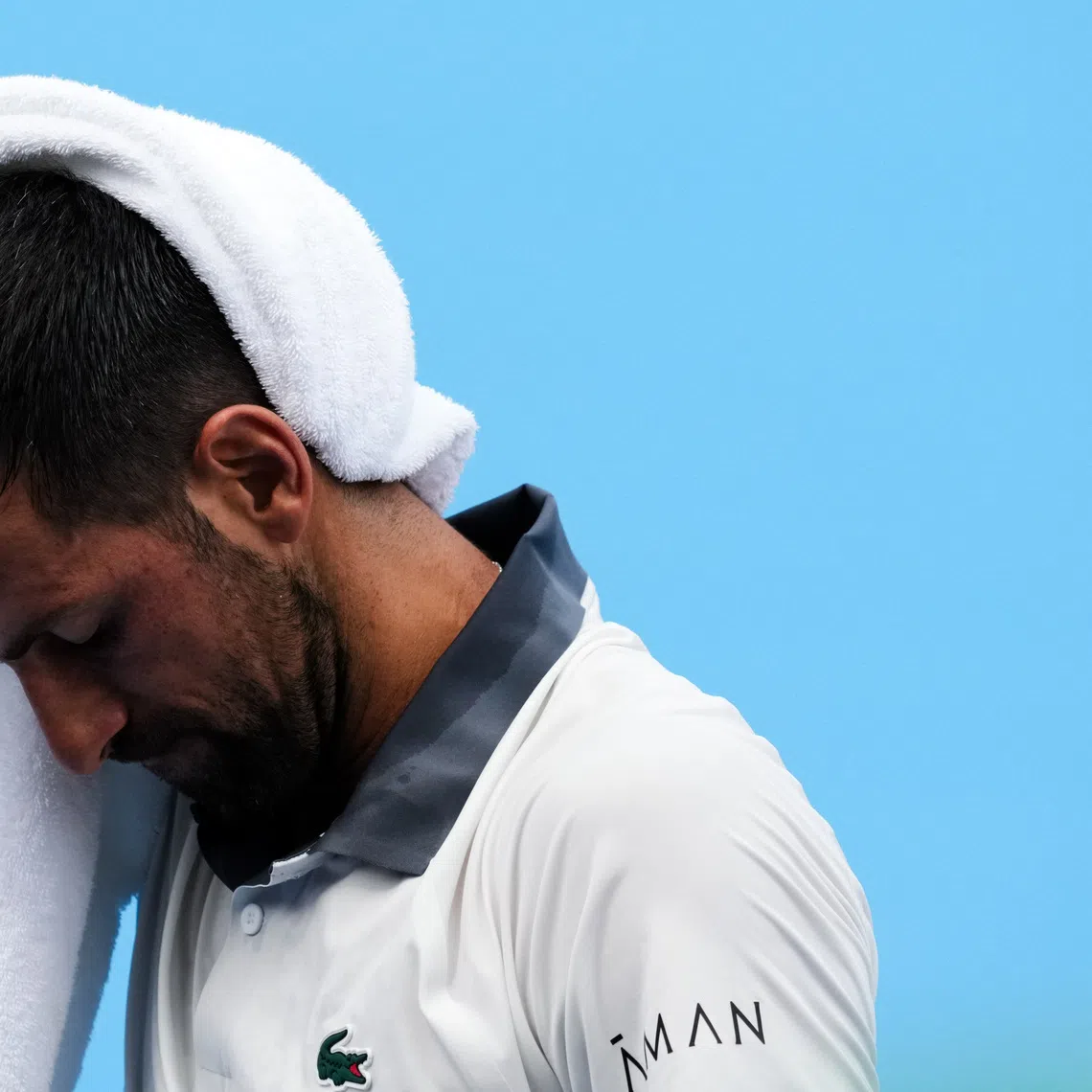 Aug 15, 2026; Mason, OH, USA;  Novak Djokovic (SRB) wipes his head after a point against Thiago Agustín Tirante (ARG) during the Cincinnati Open at Lindner Family Tennis Center. Mandatory Credit: Aaron Doster-Imagn Images