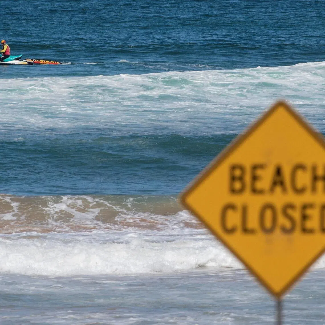 A lifeguard patrols North Steyne beach as beaches are closed after recent shark attacks, in Sydney, Australia, on Jan 20, 2026.
