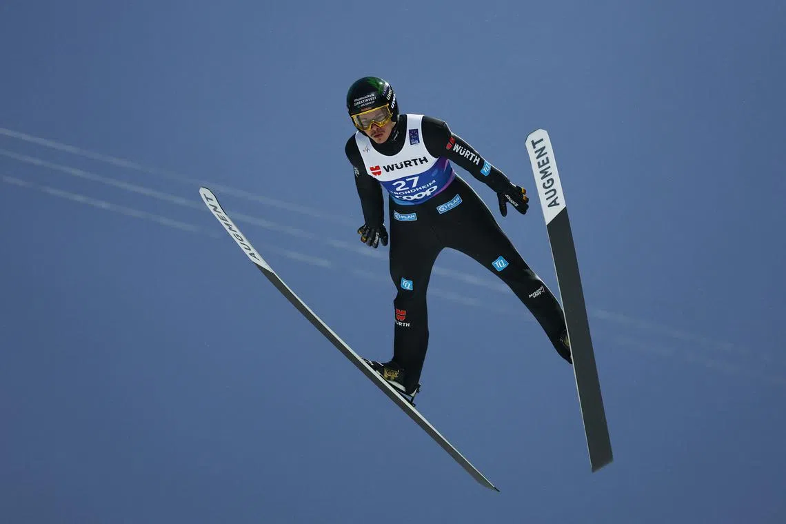 FILE PHOTO: Nordic Skiing - FIS Nordic World Ski Championships - Ski Jumping  - Trondheim, Norway - March 2, 2025 Germany's Philipp Raimund in action Men's Individual HS102 - First Round REUTERS/Kai Pfaffenbach/File Photo