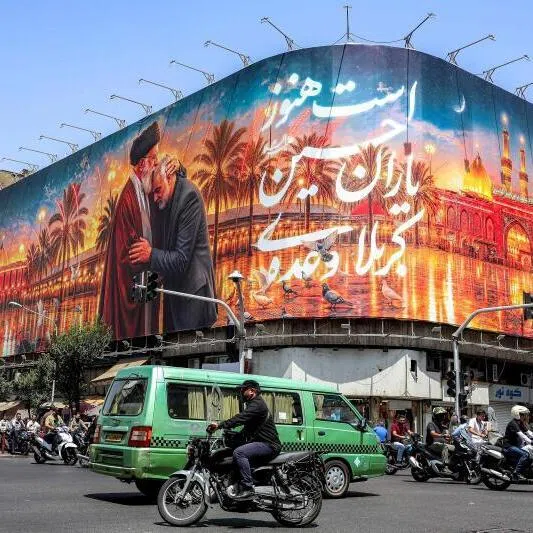 A billboard at a busy junction in Tehran depicts Iran’s slain supreme leader, Ali Khamenei, kissing the slain Islamic revolutionary guards commander, Qasem Soleimani.