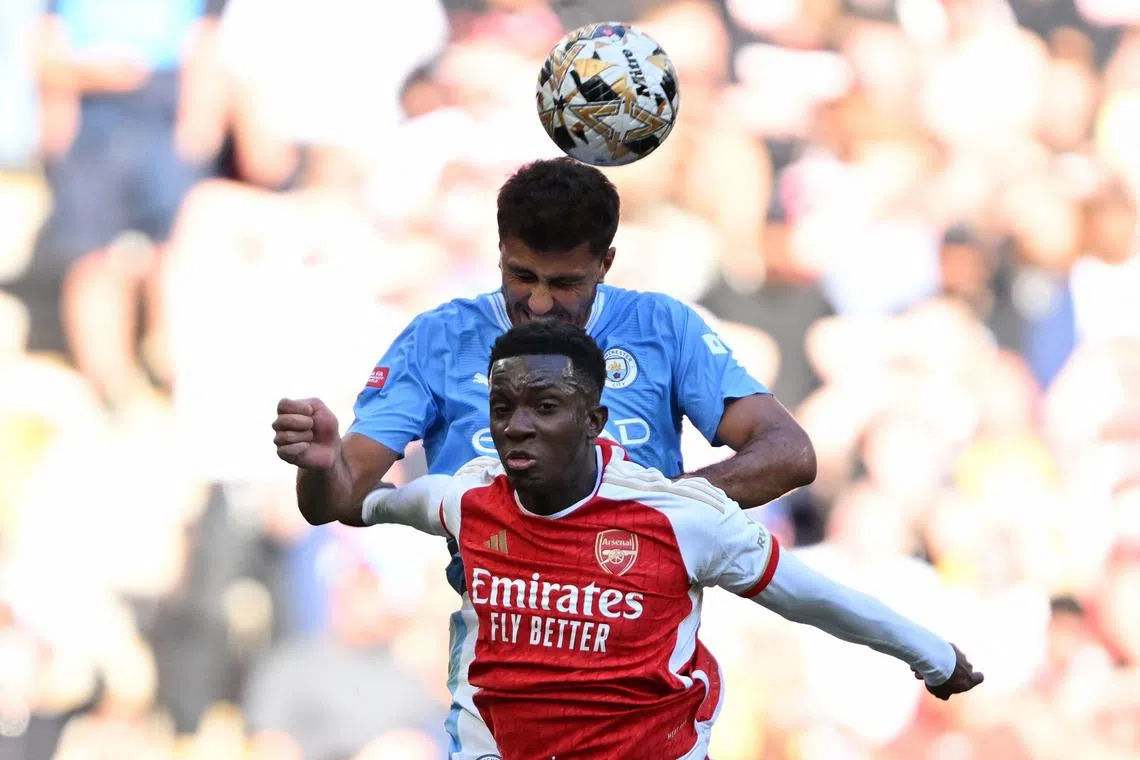Manchester City's Rodri battling for the ball with Arsenal striker Eddie Nketiah during the Community Shield in August.