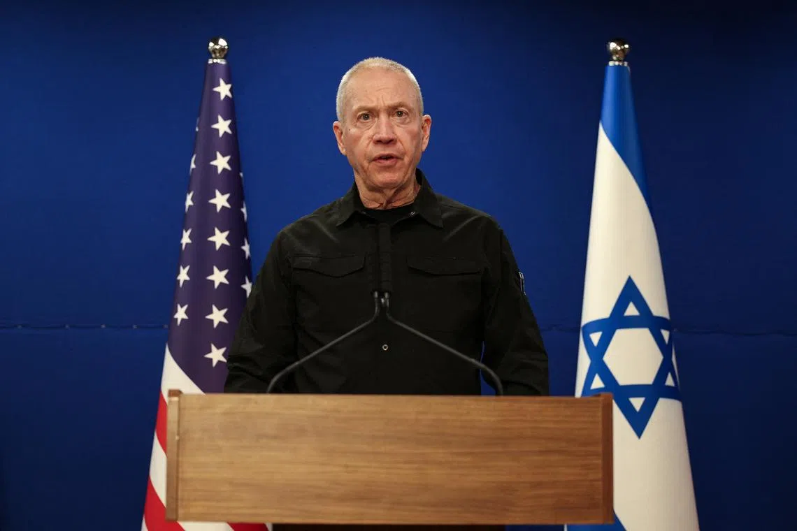 FILE PHOTO: Israeli Defense Minister Yoav Gallant speaks during a joint press conference with U.S. Secretary of Defense Lloyd Austin at Israel's Ministry of Defense in Tel Aviv, Israel December 18, 2023. REUTERS/Violeta Santos Moura/File Photo