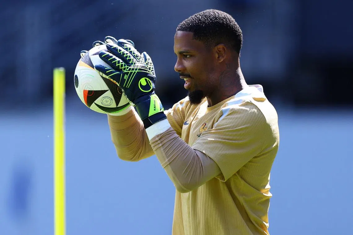 Soccer Football - Euro 2024 - France Training - Paderborn Arena, Paderborn, Germany - June 24, 2024 France's Mike Maignan during training REUTERS/Kacper Pempel/File Photo