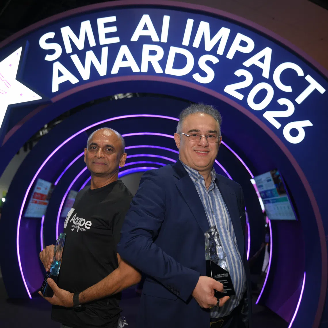 Anil David (left), founder of Agape Connecting People, and Blue Aqua International Group founder Dr. Farshad Shishehchian, pictured after the SME AI Impact Awards ceremony as part of IMDA’s SMEs Go Digital Day at the Suntec Convention Centre on Oct 13.
