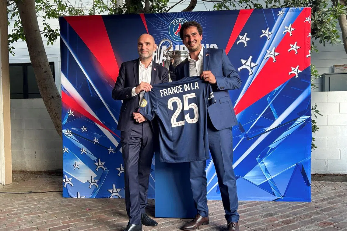 Paris St Germain CEO Victoriano Melero and Adrien Frier, the French consul-general in Los Angeles,  pose for a picture in Beverly Hills, U.S., June 12, 2025. REUTERS/Rory Carroll