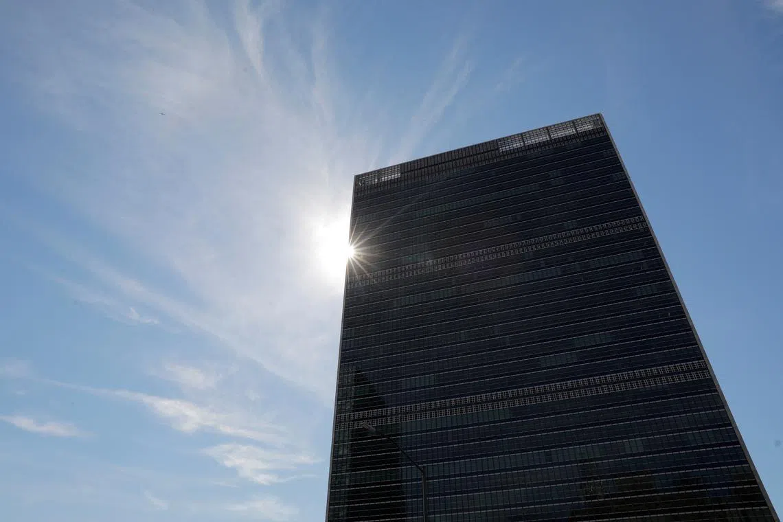 FILE PHOTO: The sun shines behind the United Nations Secretariat Building at the United Nations Headquarters, in New York City, New York, U.S., June 18, 2021. REUTERS/Andrew Kelly/File Photo