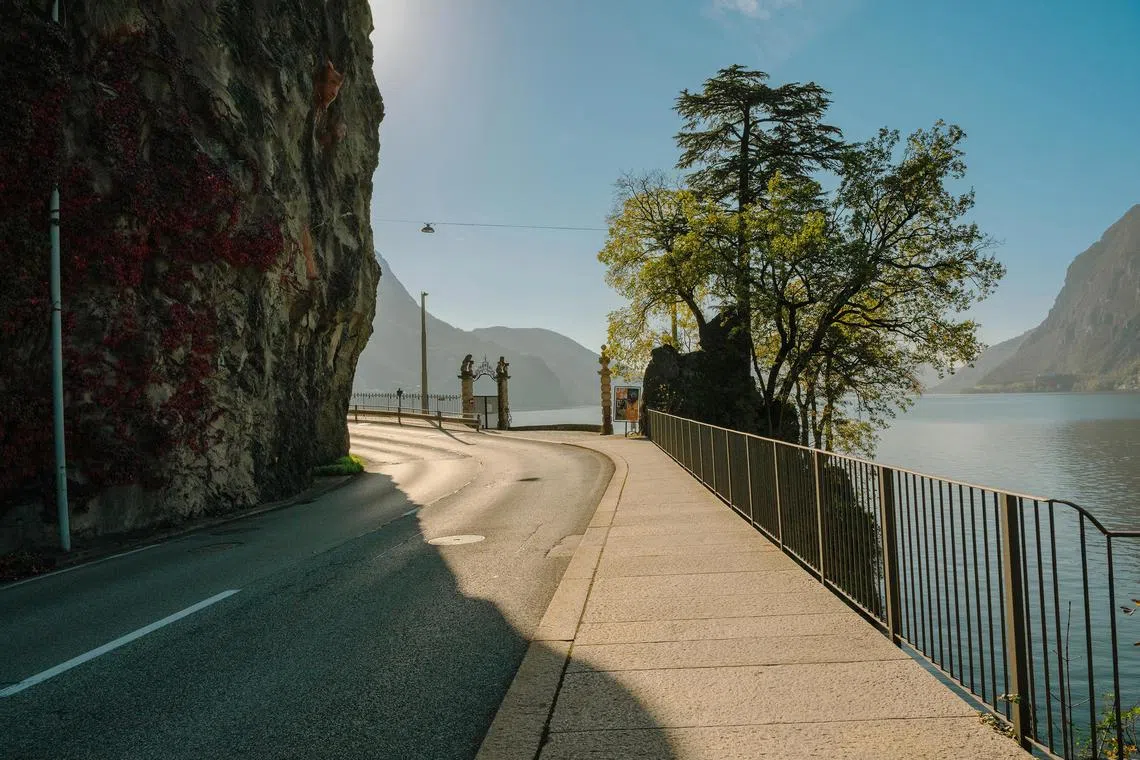 The road in Lugano, Switzerland bends near the gates that announce an entrance to the Villa Favorita on Nov. 1, 2024. Cast off by the Nazis, but heralded by curators, the artist’s painting of his doctor, made just before Vincent van Gogh’s suicide, has not been seen in 34 years. (Maurizio Fiorino/The New York Times)