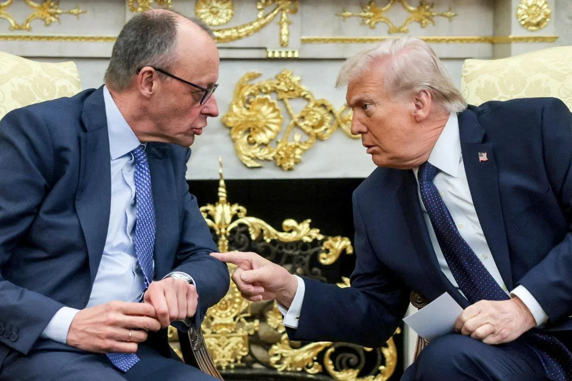 FILE PHOTO: U.S. President Donald Trump and German Chancellor Friedrich Merz meet in the Oval Office at the White House in Washington, D.C., U.S., March 3, 2026. REUTERS/Jonathan Ernst/File Photo