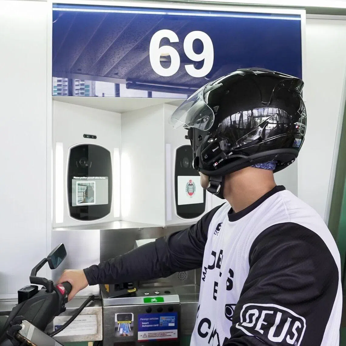 Under the trial, motorcyclists entering Singapore can use facial recognition instead of fingerprint scanning to clear immigration.