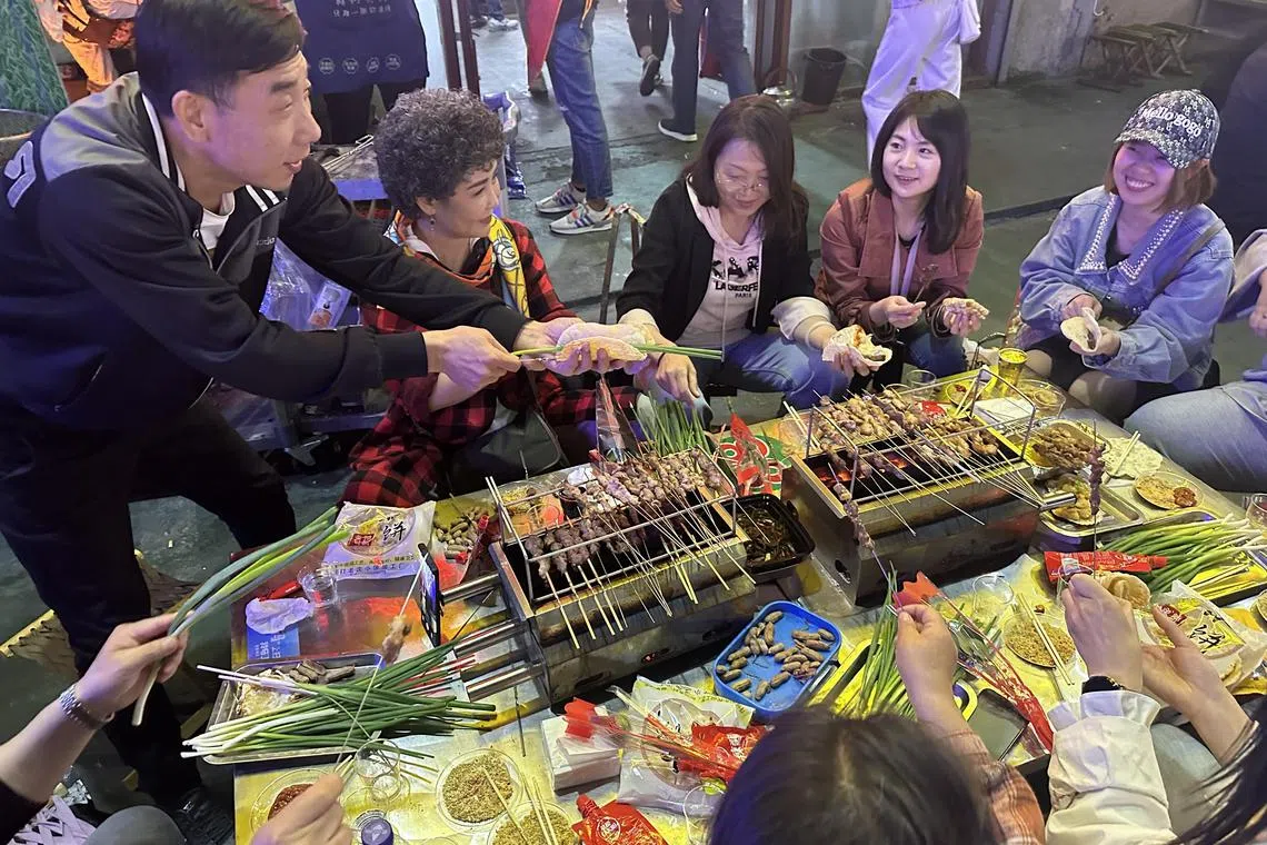 In Zibo, barbecue diners grill skewers themselves on their own little stoves.