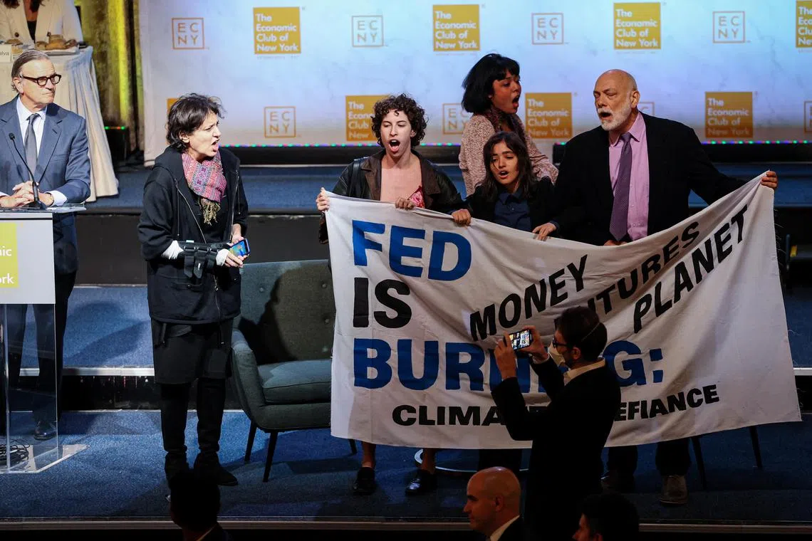 Climate activists disrupt a meeting of the Economic Club of New York just prior to a speech by Federal Reserve chairman Jerome Powell, in New York City.