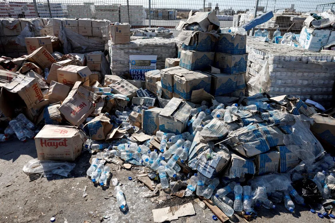 FILE PHOTO: Parcels of humanitarian aid await transfer into Gaza, at the Gaza side of the Kerem Shalom crossing in the Gaza Strip, July 24, 2025. REUTERS/Amir Cohen    EDITOR'S NOTE: REUTERS PHOTOGRAPHS WERE REVIEWED BY THE IDF AS PART OF THE CONDITIONS OF THE EMBED. NO PHOTOS WERE REMOVED./File Photo