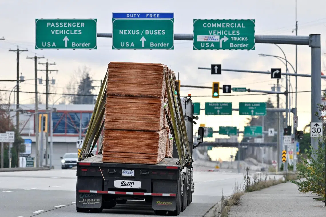 A commercial truck heads towards the U.S. Customs and Border Protection (CBP) Pacific Highway Port of Entry from south Surrey, British Columbia, Canada, November 26, 2024.  REUTERS/Jennifer Gauthier
