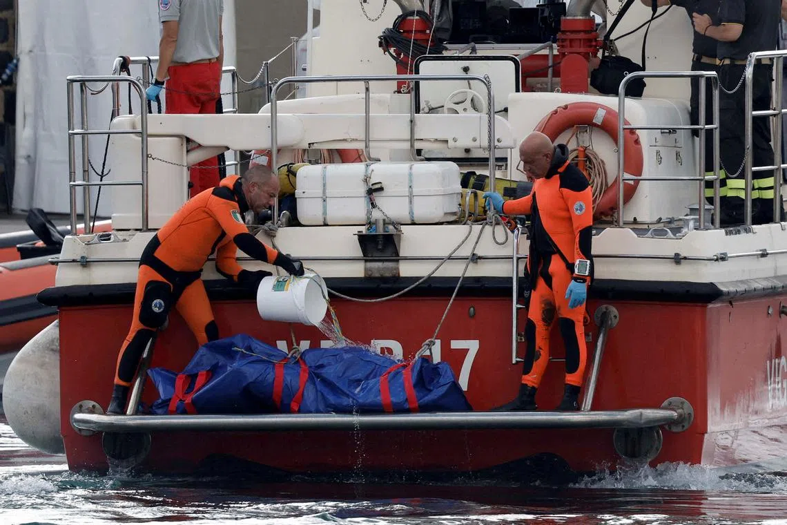 FILE PHOTO: Rescue personnel pour water on a body bag containing the corpse of British entrepreneur Mike Lynch, who died when a yacht owned by his family sank off the coast of Porticello, near the Sicilian city of Palermo, Italy, August 22, 2024. REUTERS/Louiza Vradi/File Photo