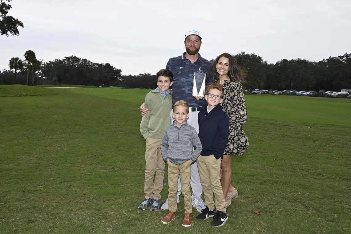 Golfer Chris Kirk with his family after receiving the 2023 PGA Tour Courage Award at the RSM Classic. 
