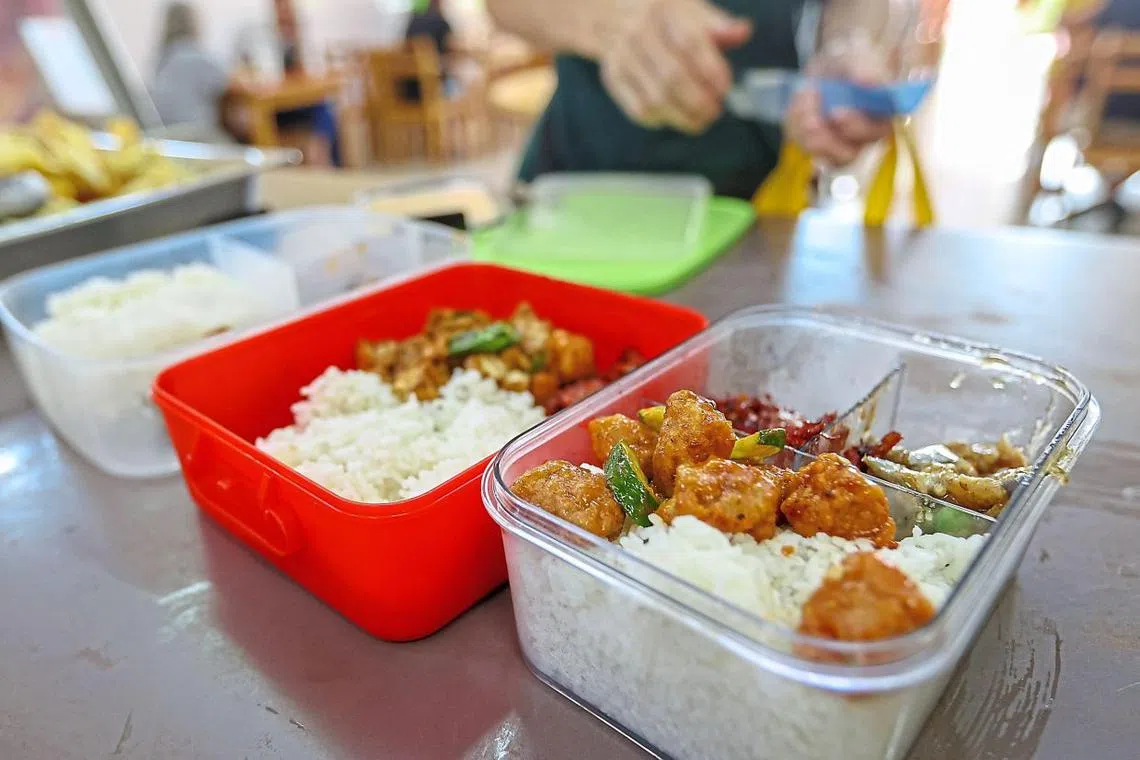 Lunch crowd at V Fortune Land Vegetarian Cafe. This mixed rice stall offers delectable dishes at an affordable RM2. — GLENN GUAN/The Star