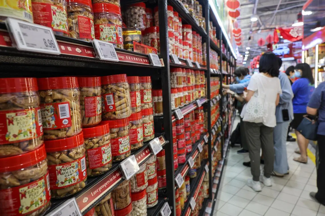 The vouchers are part of efforts to help customers stretch their dollar in the Chinese New Year season. 