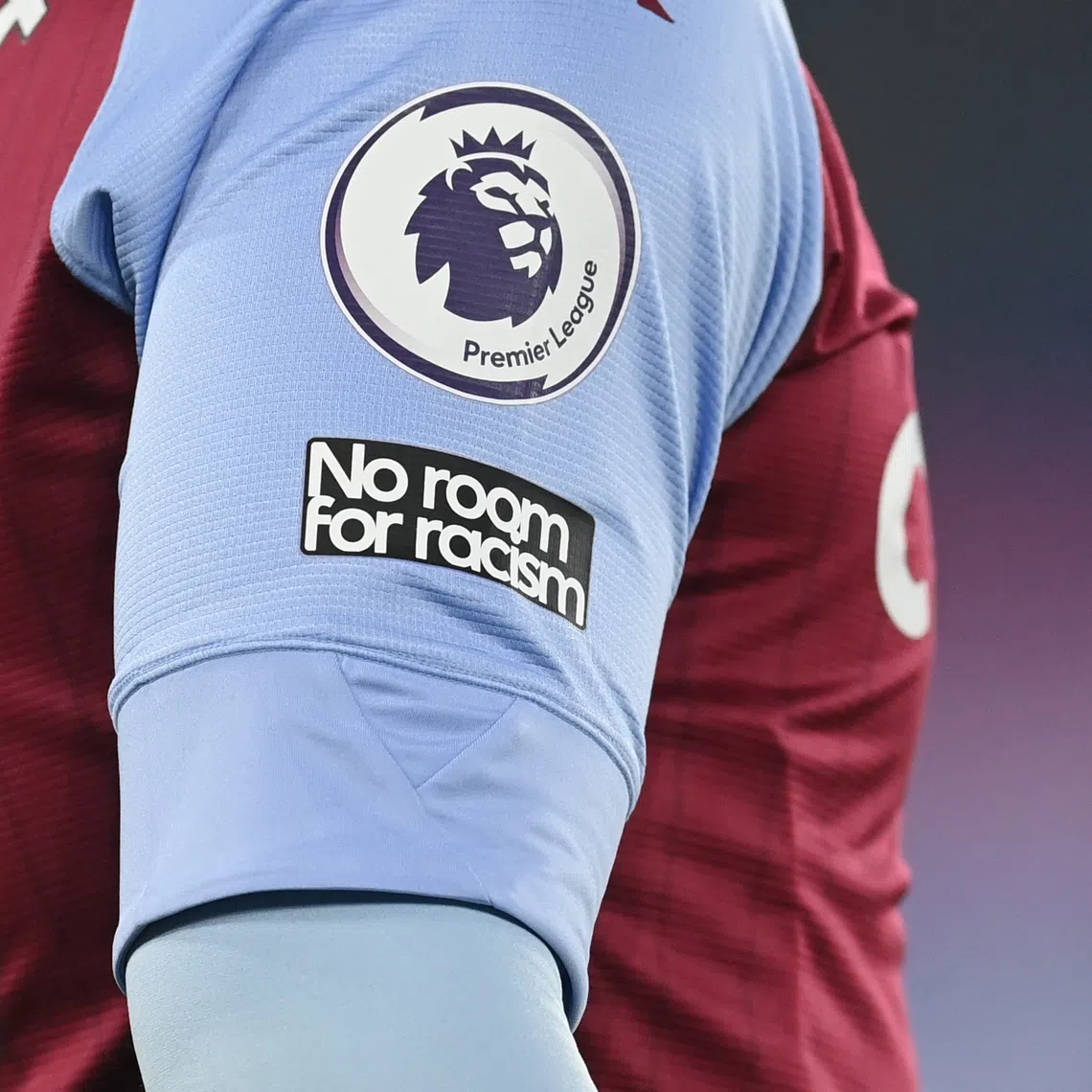 A ‘No room for racism’ badge is seen during a Premier League match.