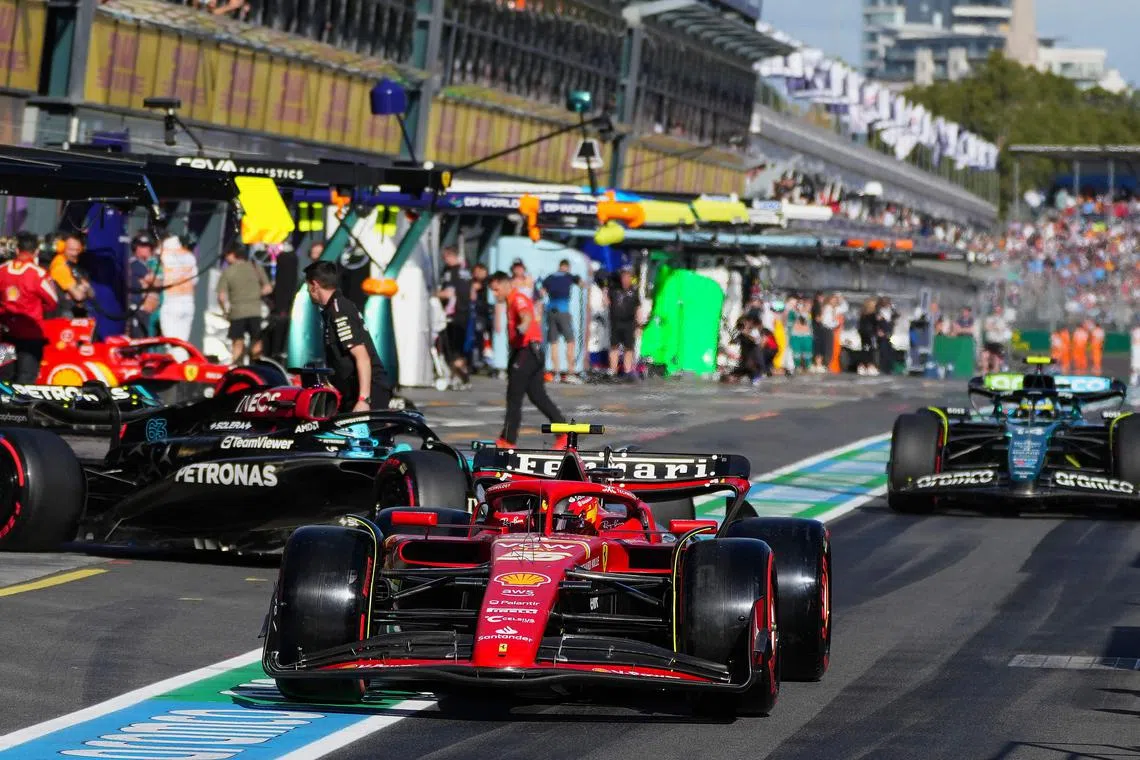 Ferrari's Spanish driver Carlos Sainz leaves the pit lane during the qualifying session of the Australian Grand Prix.