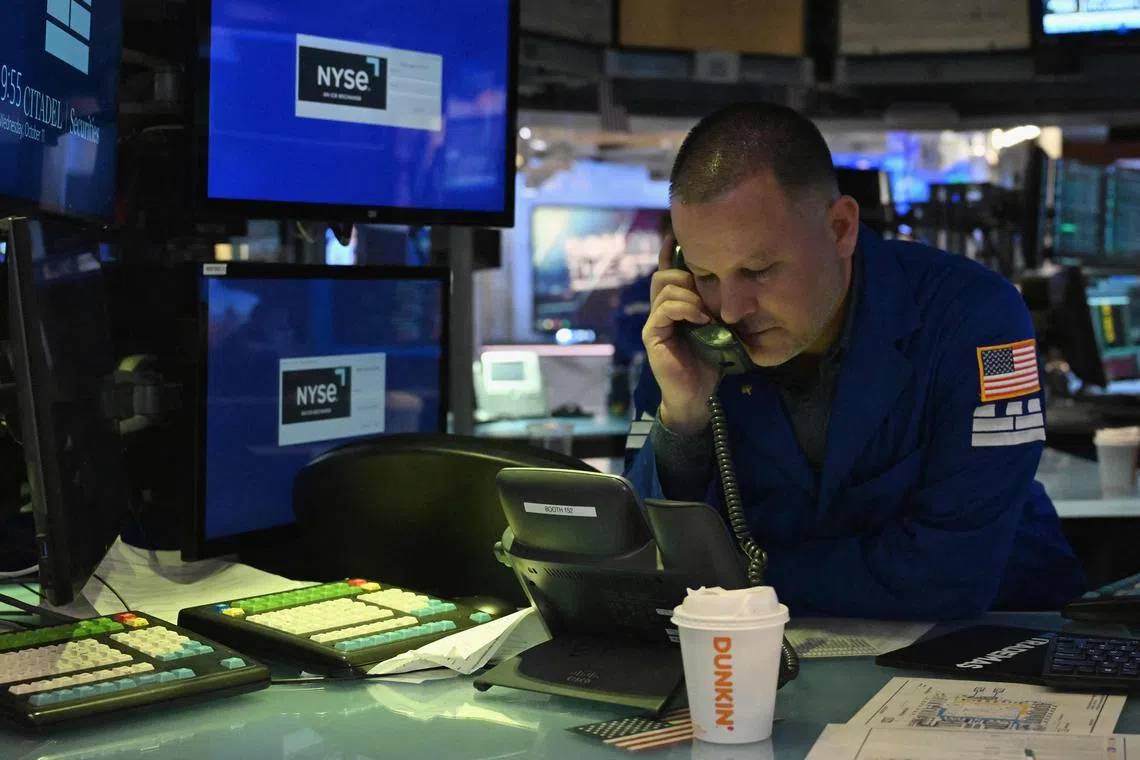 Traders works on the floor of the New York Stock Exchange, in New York City.