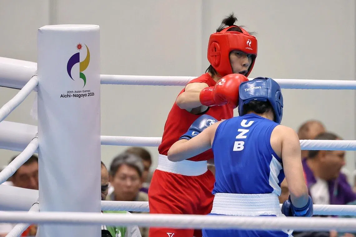 Lin Yu-ting (left) of Chinese Taipei in action against Sitora Turdibekova of Uzbekistan during the Asian Games boxing women’s 60kg semi-final at Nishio Gymnasium on Sept 30.
