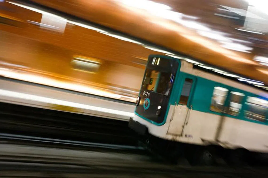 FILE PHOTO: A metro operated by the Paris transport network RATP makes its way inside the Arts et Metiers subway station in Paris on the eve of the third nationwide day of strike and protests against French government's pension reform plan in France, February 6, 2023. REUTERS/Gonzalo Fuentes