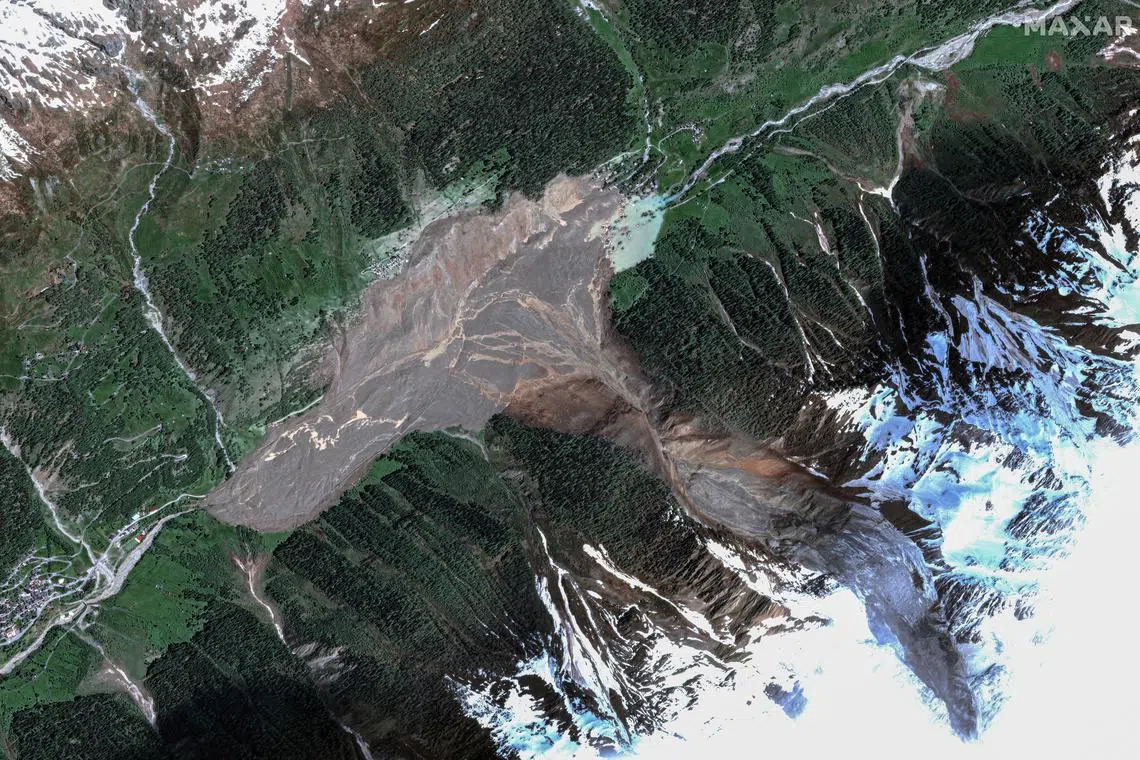 A satellite image shows Blatten after a glacier in the Swiss Alps partially collapsed and tumbled onto the village.
