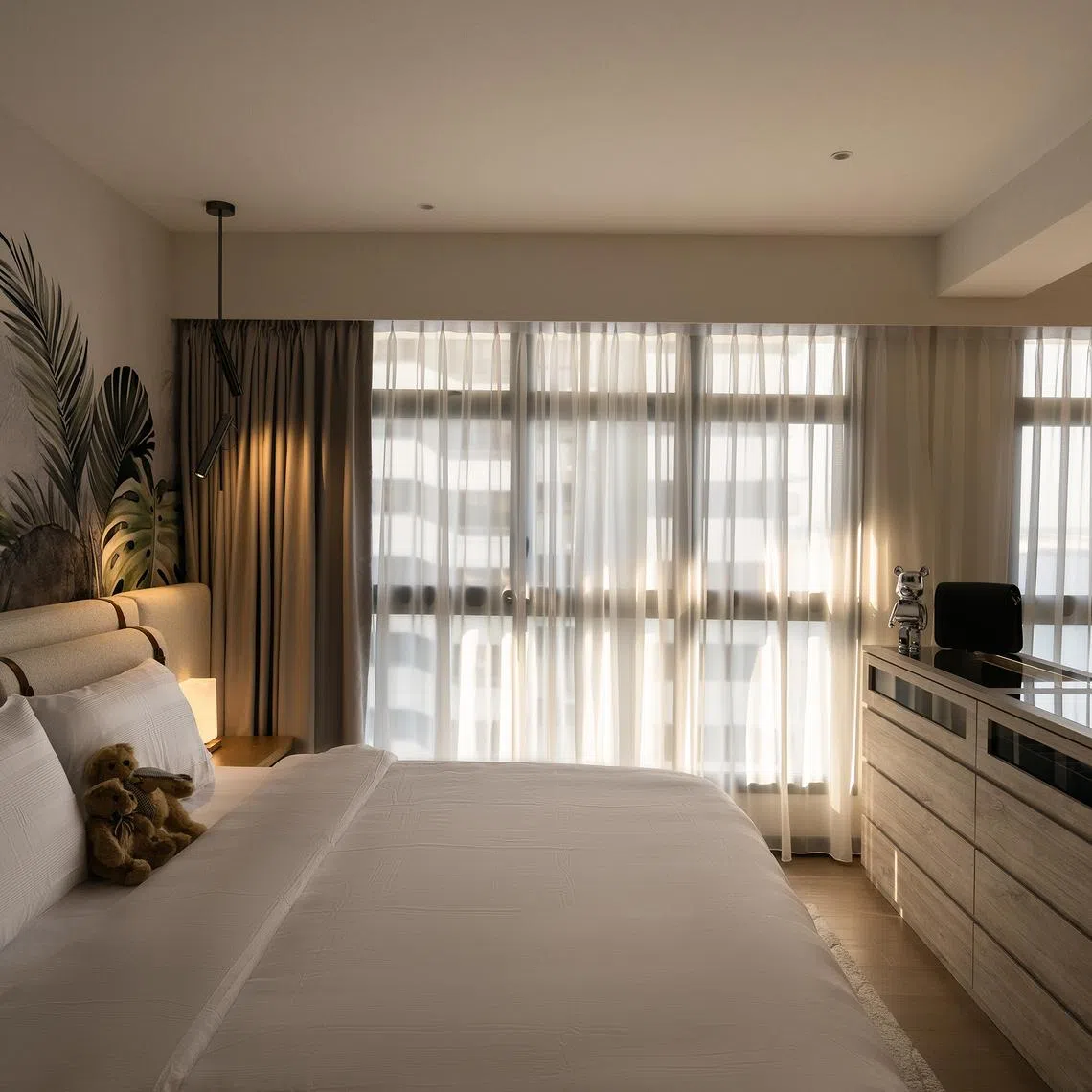 Natural light illuminates the tropical mural that sets the tone for the home’s resort aesthetic.