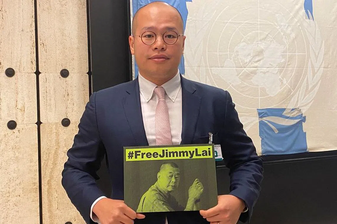 FILE PHOTO: Sebastien Lai, son of Hong Kong media tycoon Jimmy Lai, holds a sign calling for the release of his father on the sidelines of the United Nations Human Rights Council in Geneva, Switzerland, September 27, 2023.  REUTERS/Gabrielle Tetrault-Farber/File Photo