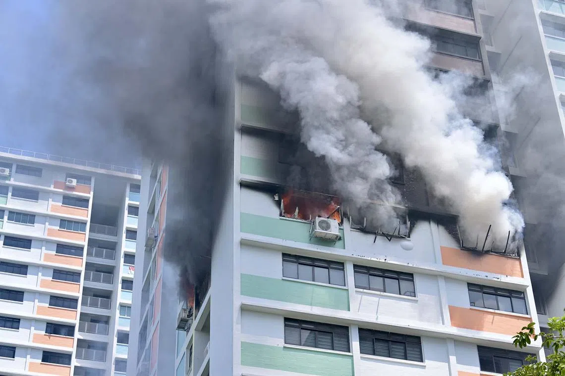 A fire raging at Block 229 Lorong 8 Toa Payoh in Singapore, July 29, 2025. Three people were assessed for smoke inhalation and burn injuries, and taken to Singapore General Hospital.