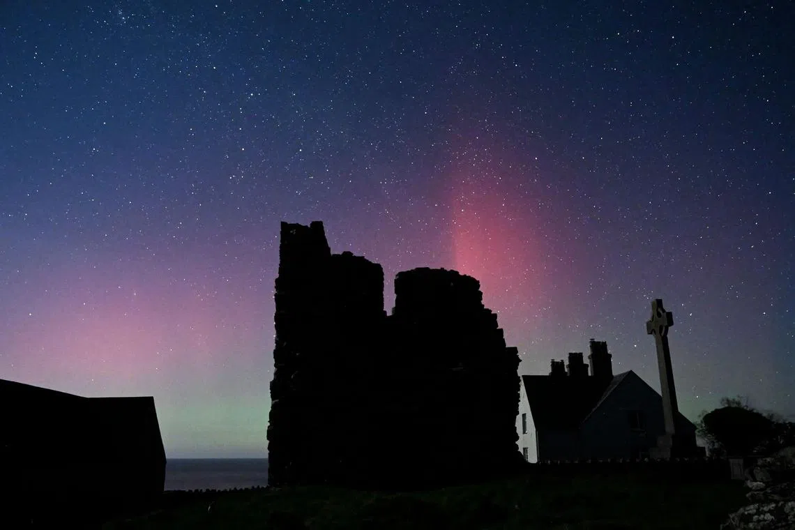 The Aurora Borealis above buildings on Ynys Enlli, known as Bardsey Island in English, an island off of the west coast of Wales, south west of Pwllheli. 