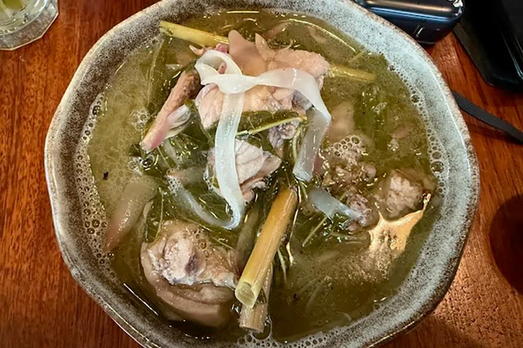 Ayam Pansoh, a Sarawak traditional dish made by cooking marinated chicken inside a bamboo stalk served at Kantin at the Granary, a bustling eatery in Kuching, Sarawak on Aug 14.