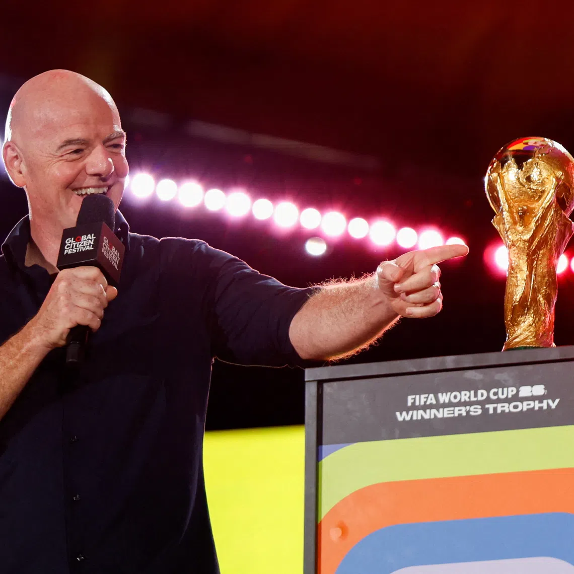 FIFA president Gianni Infantino gestures to the 2026 FIFA World Cup winner's trophy during the 2025 Global Citizen Festival in New York City, U.S., September 27, 2025. REUTERS/Kylie Cooper